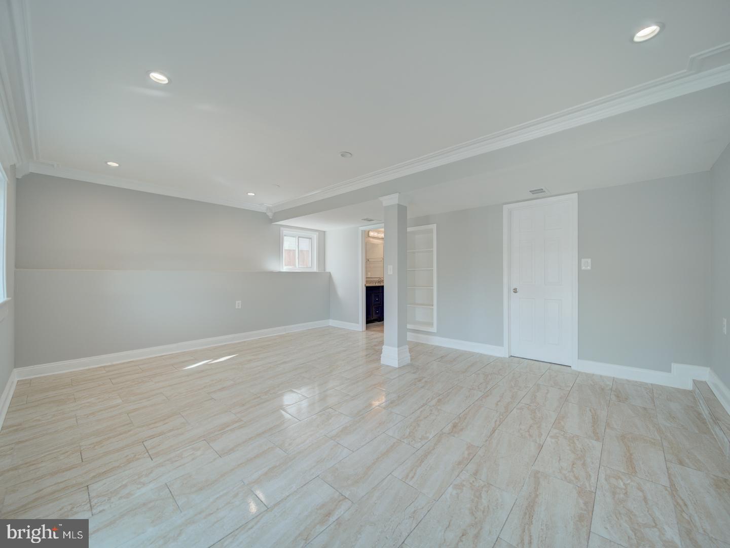 1300 East Beech Road Sterling, VA 20164 - Photo 27 of 35 a view of an empty room with wooden floor and a window