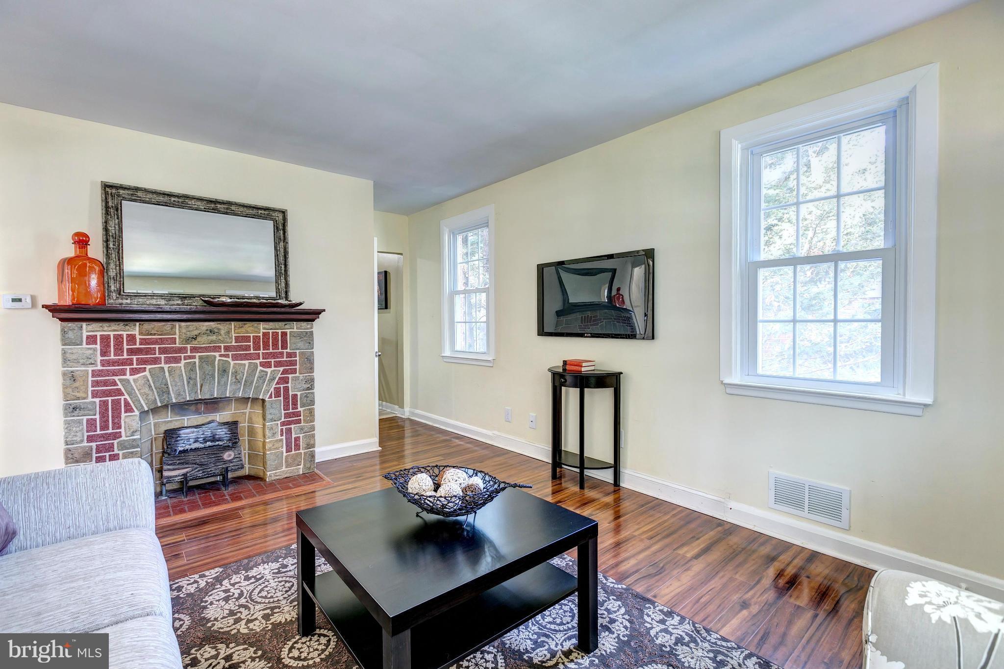 6927 Chambers Road Baltimore, MD 21234 - Photo 5 of 30 Cozy Up By The Charming Brick Fireplace