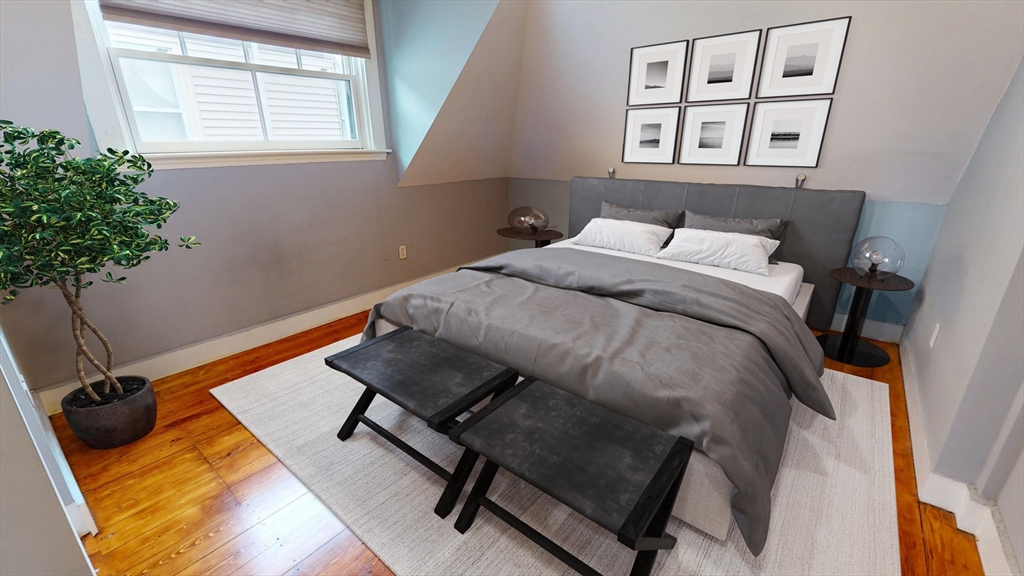 126 Calumet Street, Unit 3 Boston, MA 02120 - Photo 2 of 5 a bedroom with a bed and a window