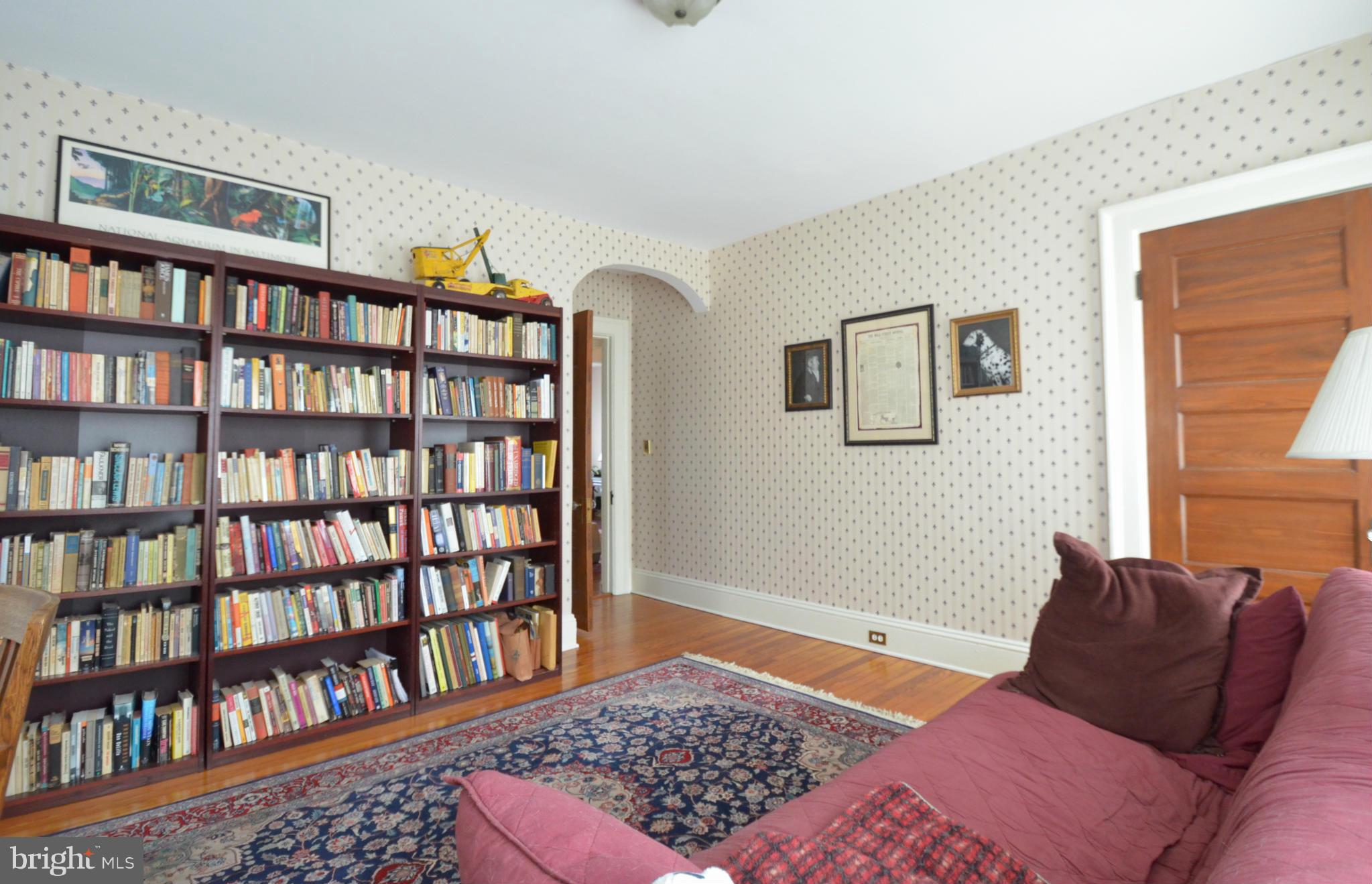 311 Oakdale Road Baltimore, MD 21210 - Photo 21 of 26 a bedroom with a book shelf and a rug