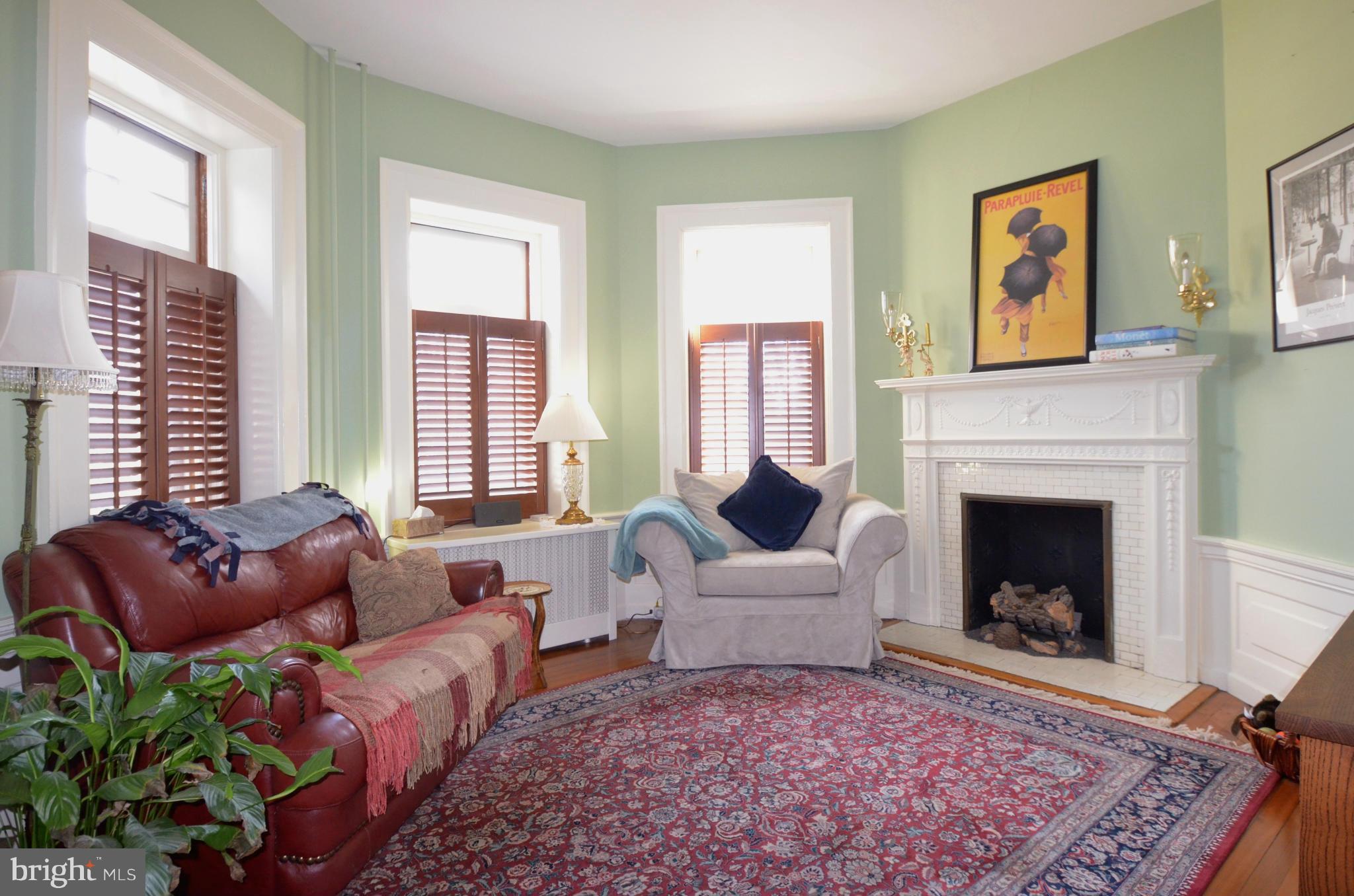 311 Oakdale Road Baltimore, MD 21210 - Photo 5 of 26 a living room with furniture fireplace and window