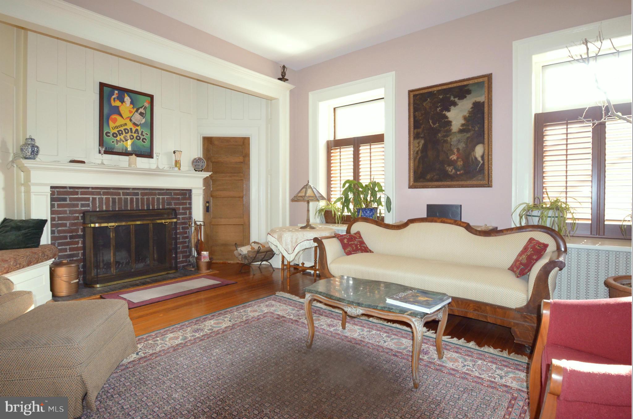 311 Oakdale Road Baltimore, MD 21210 - Photo 8 of 26 a living room with furniture and a fireplace