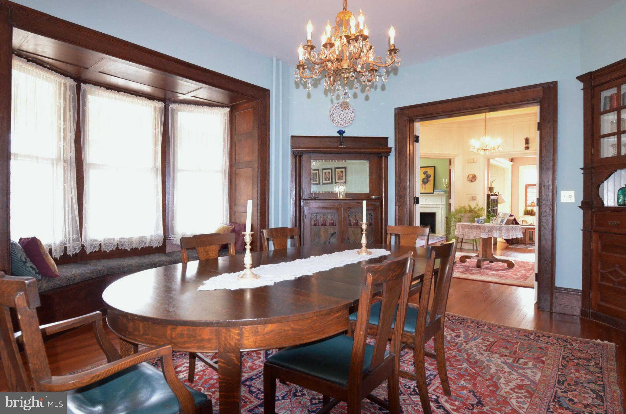 311 Oakdale Road Baltimore, MD 21210 - Photo 9 of 26 a view of a dining room with furniture window and wooden floor