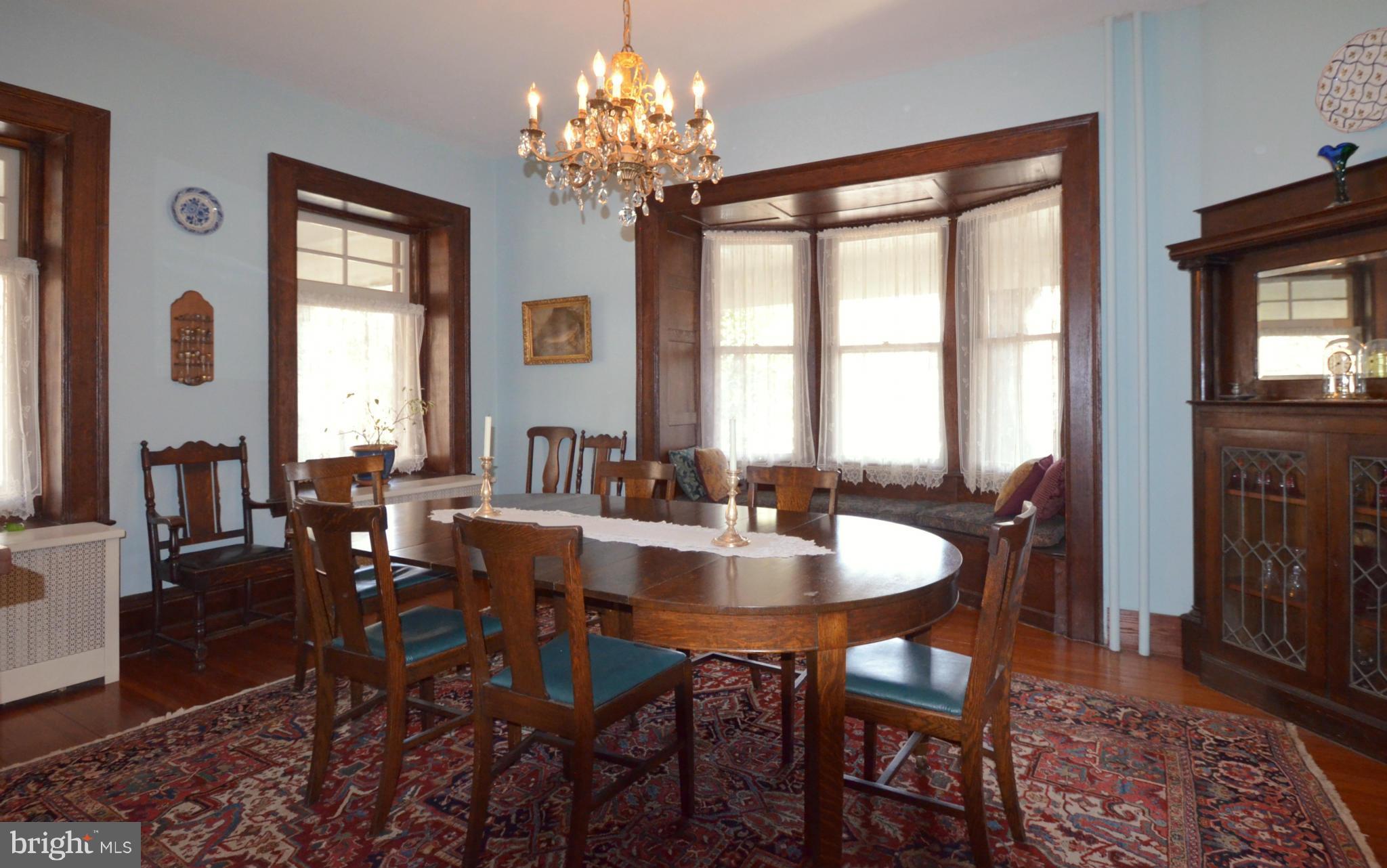 311 Oakdale Road Baltimore, MD 21210 - Photo 10 of 26 a view of a dining room with furniture window and wooden floor