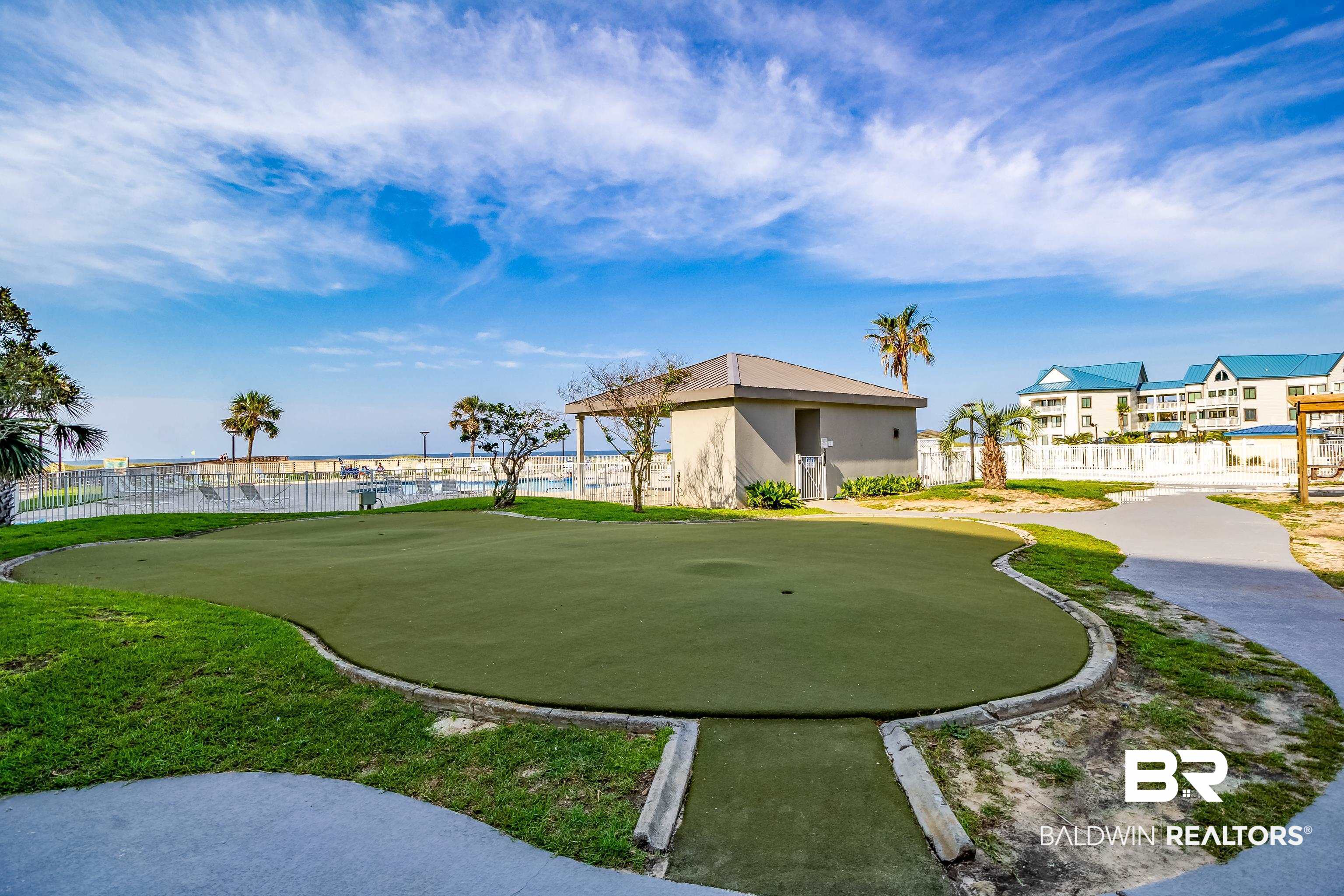 375 Plantation Road, Unit 5514 Gulf Shores, AL 36542 - Photo 25 of 44 View of community featuring an area to practice putting and a water view