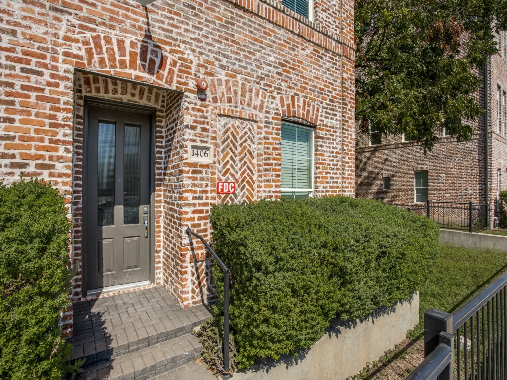 1406 Tinnin Ford Road Austin, TX 78741 - Photo 1 of 1 a front view of a house with a garden
