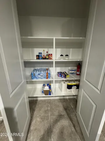 a shelf with cup and plates