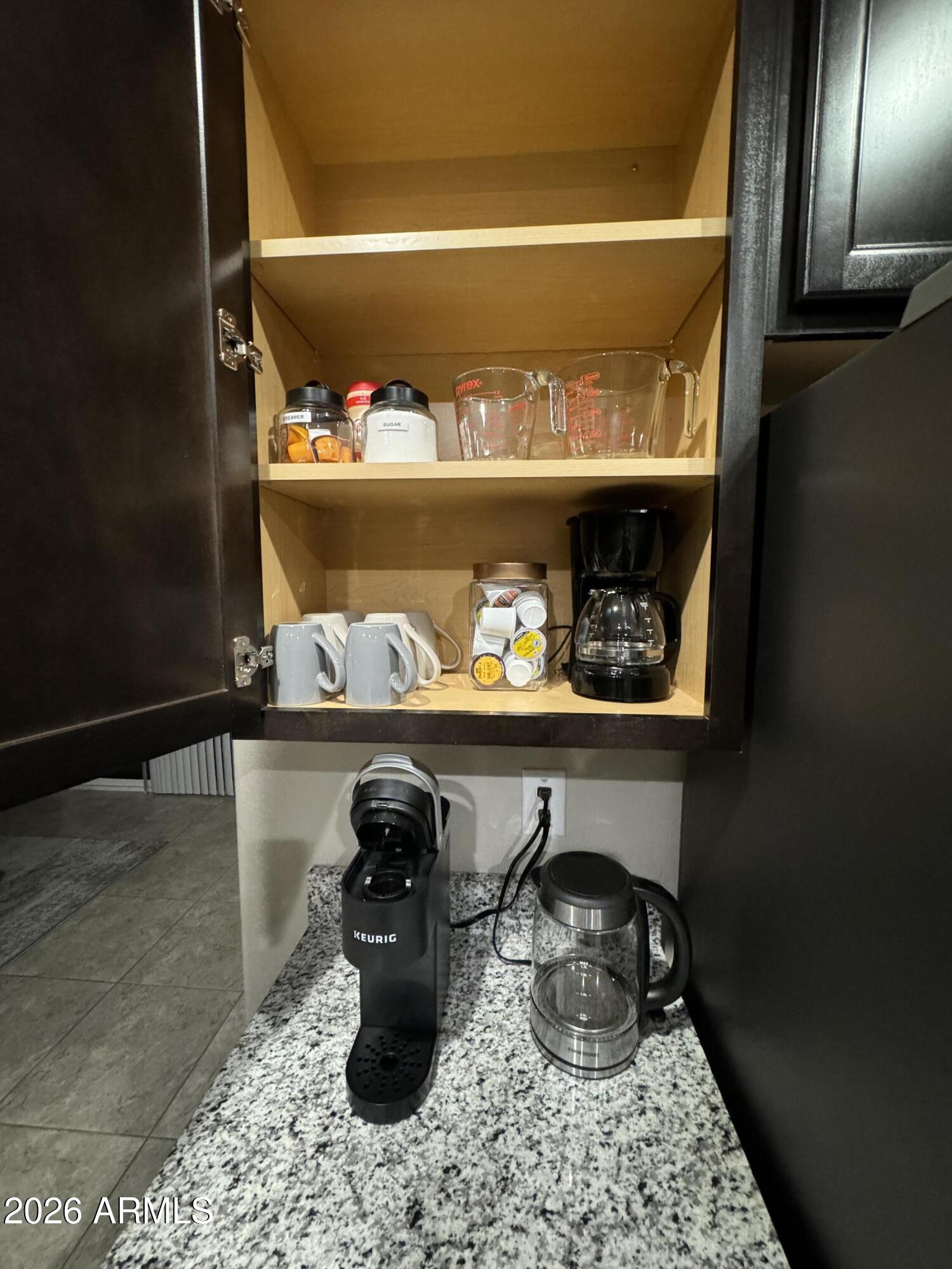 18735 North Ravello Road Maricopa, AZ 85138 - Photo 24 of 50 a room with lots of different colored cloths