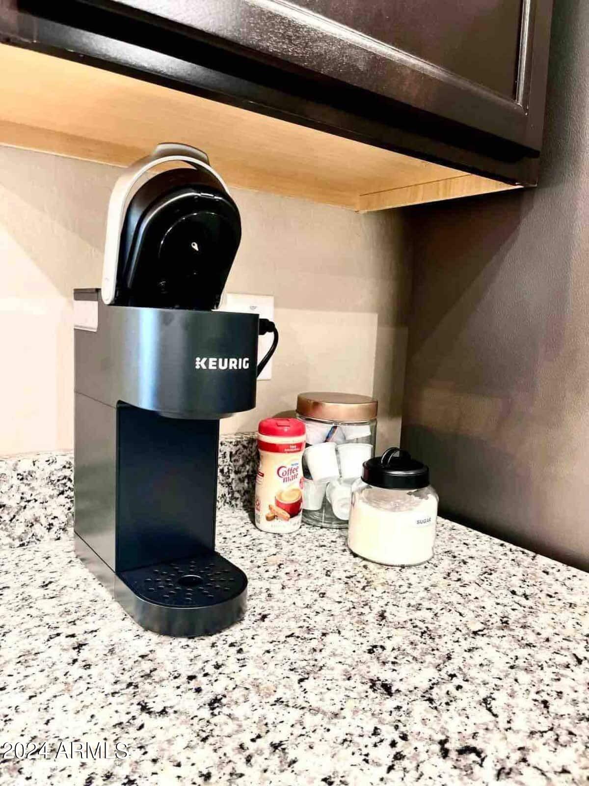 18735 North Ravello Road Maricopa, AZ 85138 - Photo 29 of 50 a close view of a sink and dishwasher with wooden floor