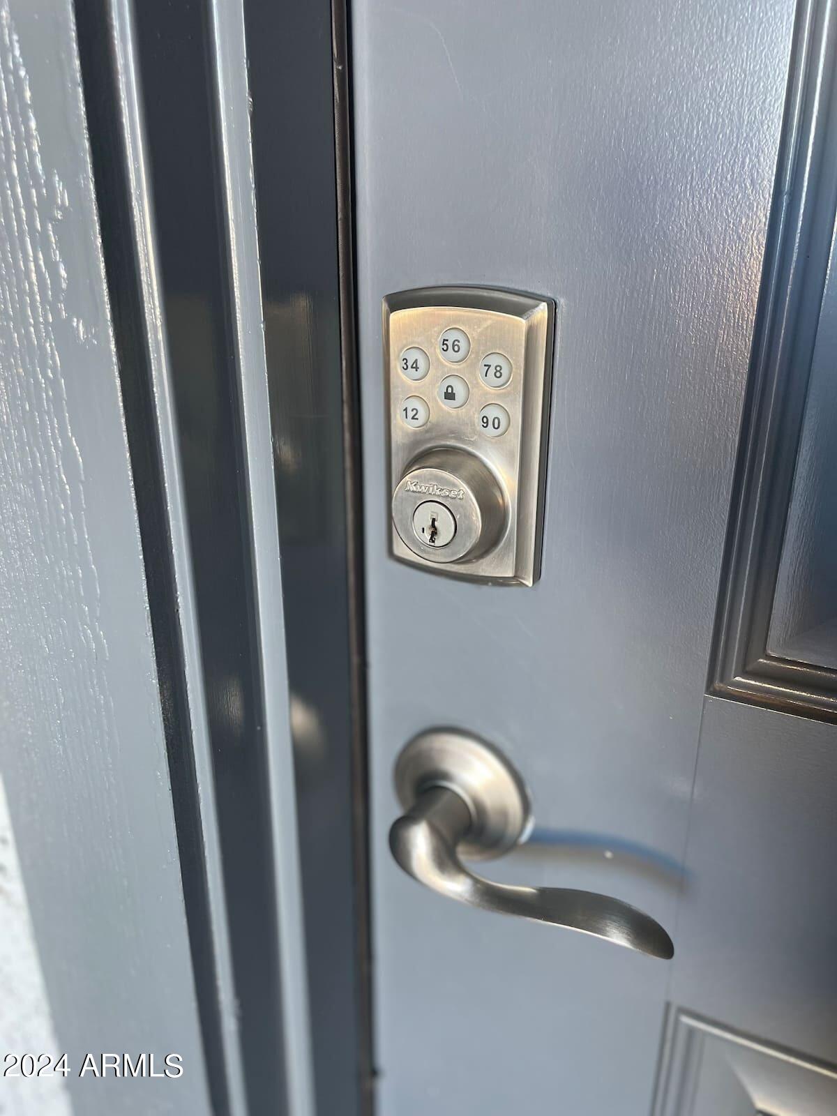 18735 North Ravello Road Maricopa, AZ 85138 - Photo 36 of 50 a close view of door lock