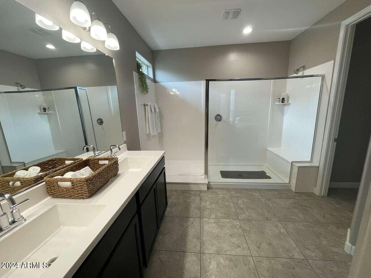 18735 North Ravello Road Maricopa, AZ 85138 - Photo 38 of 50 a bathroom with a sink a toilet and shower