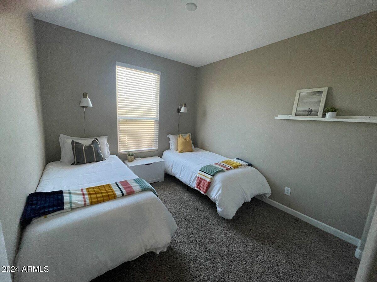 18735 North Ravello Road Maricopa, AZ 85138 - Photo 39 of 50 a bedroom with bed and window