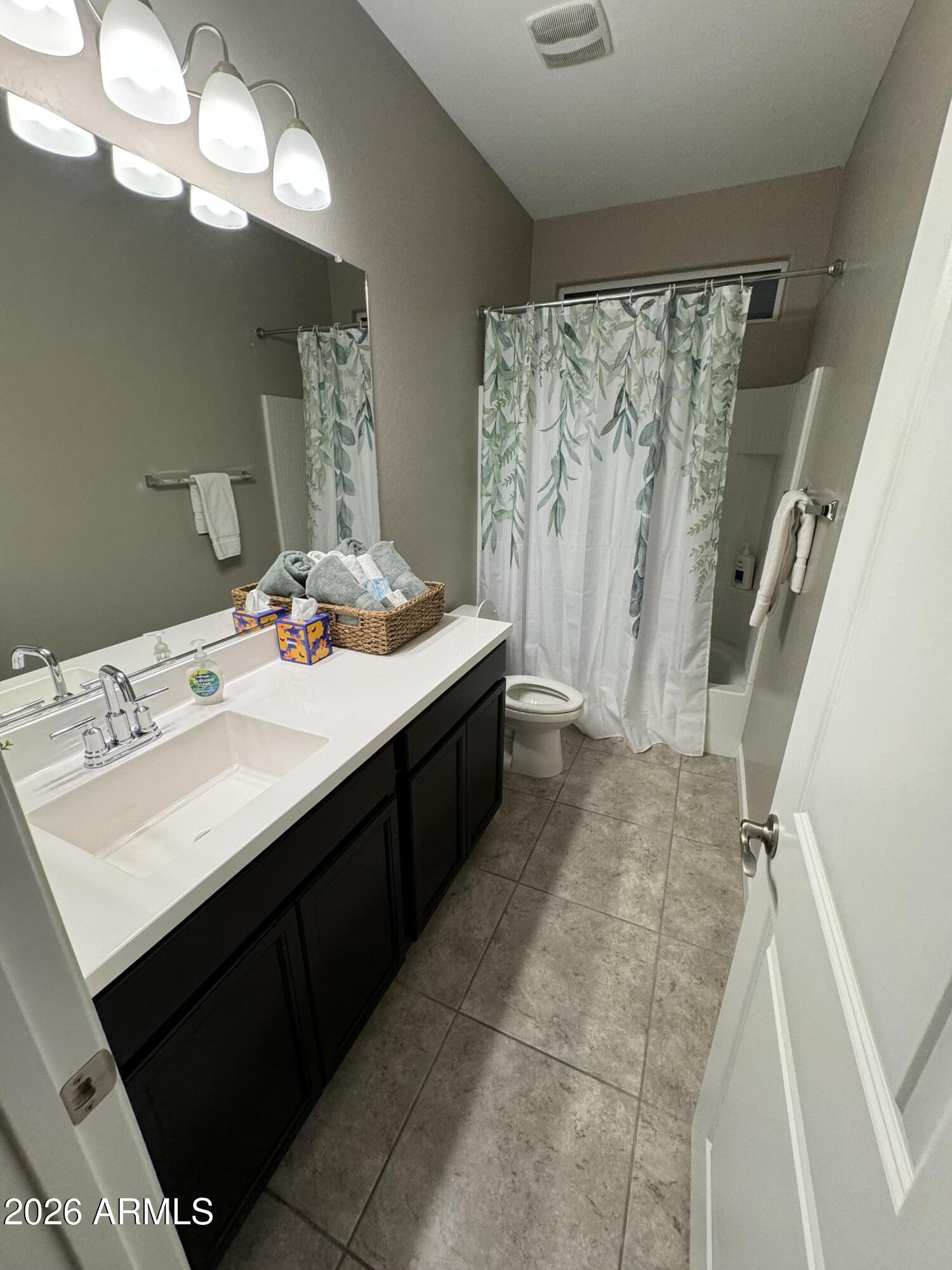 18735 North Ravello Road Maricopa, AZ 85138 - Photo 7 of 50 a bathroom with a sink a double vanity and a mirror