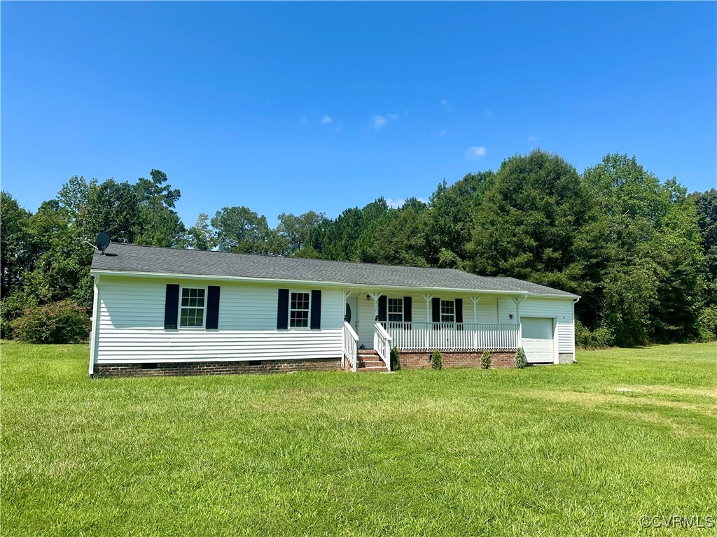 227 Horseshoe Road Jarratt, VA 23867 - Photo 1 of 14 a view of a house with a backyard