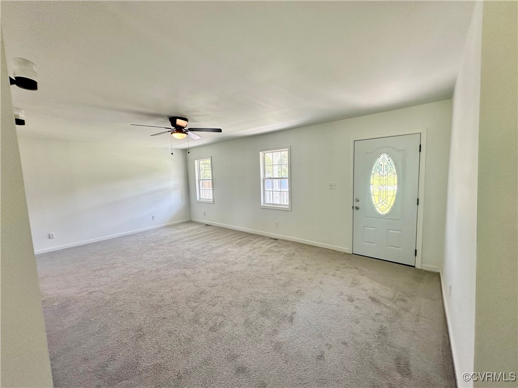227 Horseshoe Road Jarratt, VA 23867 - Photo 4 of 14 an empty room with windows and closet