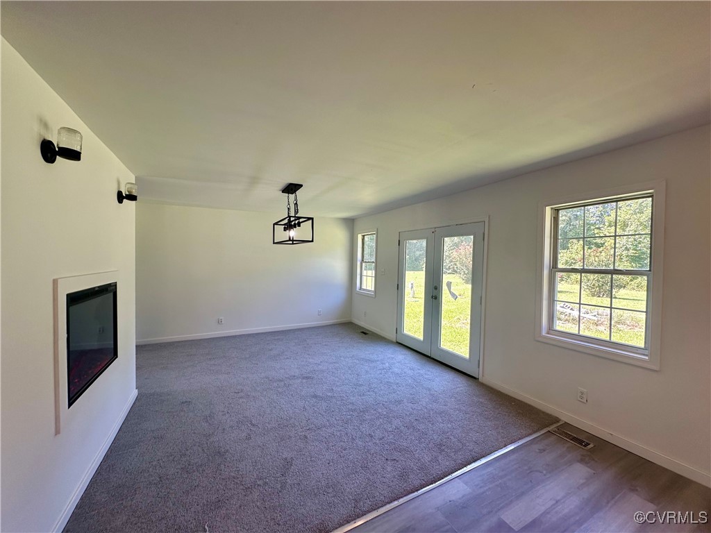 227 Horseshoe Road Jarratt, VA 23867 - Photo 5 of 14 an empty room with windows