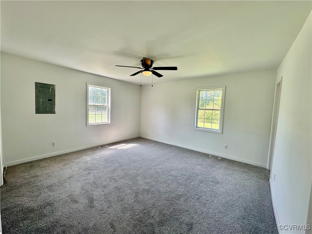227 Horseshoe Road Jarratt, VA 23867 - Photo 7 of 14 wooden floor in an empty room with a window