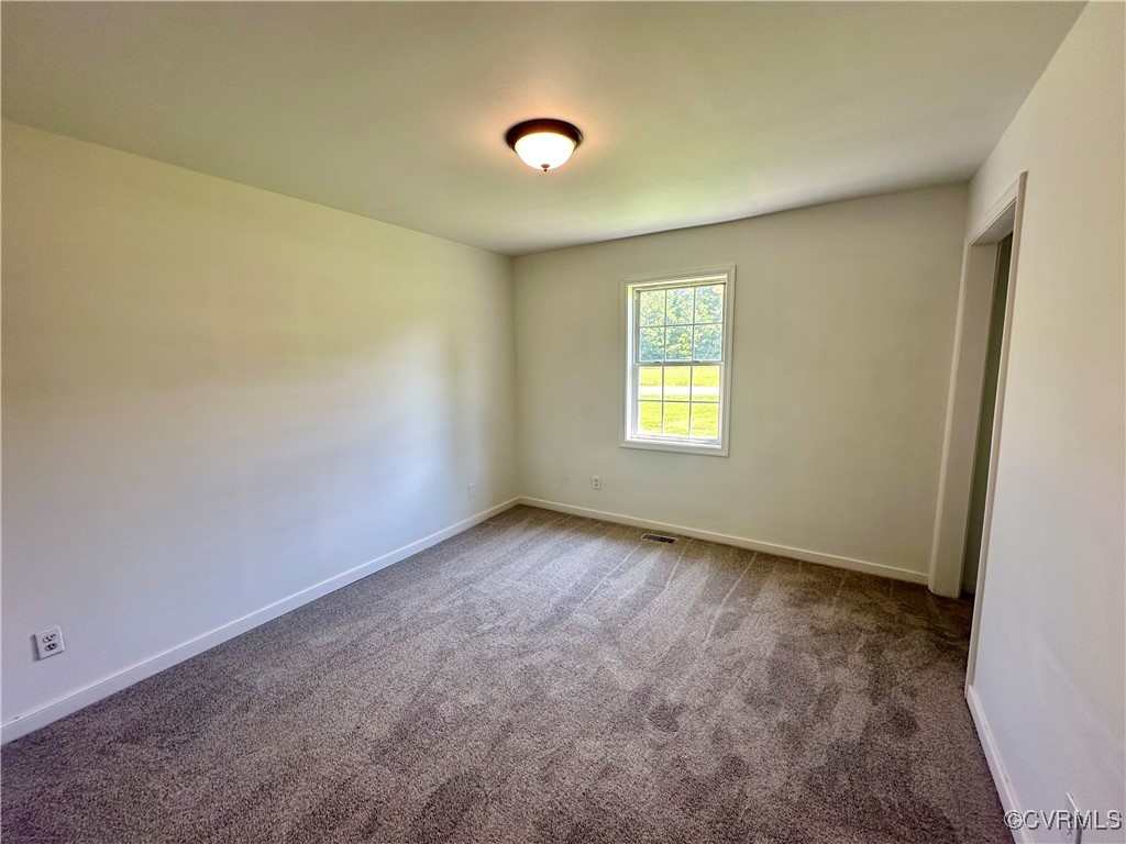 227 Horseshoe Road Jarratt, VA 23867 - Photo 9 of 14 an empty room with windows