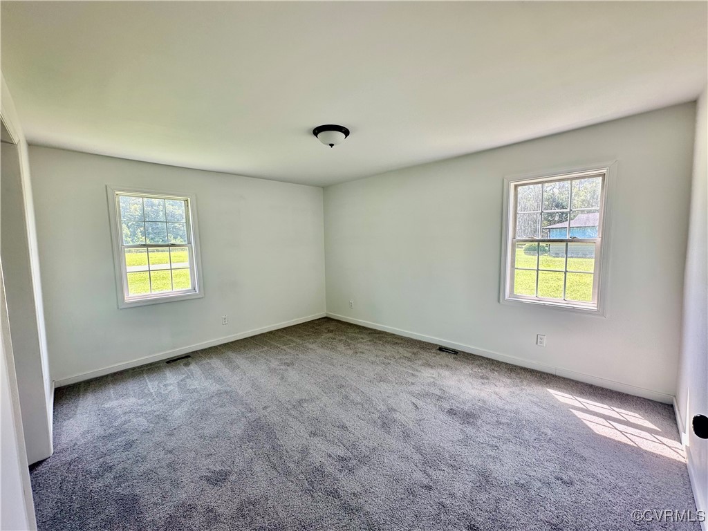227 Horseshoe Road Jarratt, VA 23867 - Photo 10 of 14 an empty room with windows