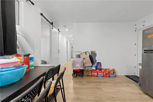 a view of play room with toys and wooden floor
