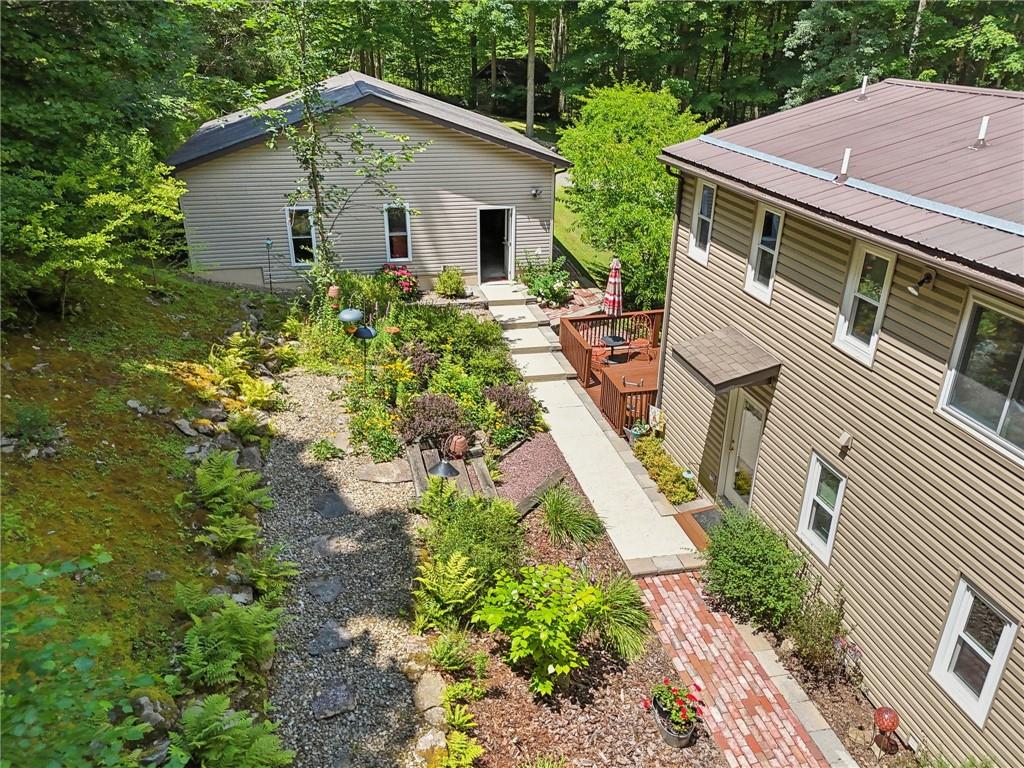 447 Creek Road Fredonia, PA 16124 - Photo 39 of 44 a backyard of a house with outdoor seating