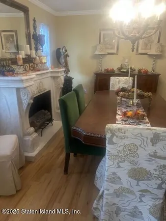 a view of kitchen with kitchen island and stainless steel appliances