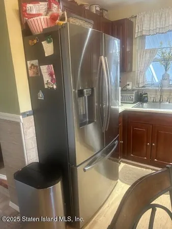 a kitchen with a stove a sink and a microwave