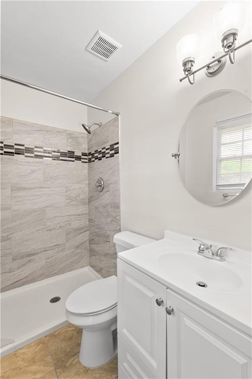 2161 Rochelle Way Southwest Atlanta, GA 30349 - Photo 11 of 15 a bathroom with a sink a toilet and shower