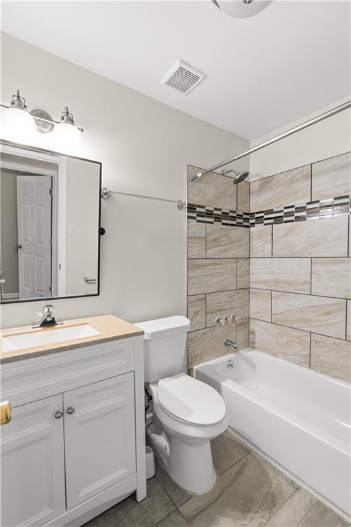 2161 Rochelle Way Southwest Atlanta, GA 30349 - Photo 12 of 15 a bathroom with a sink a toilet and bathtub