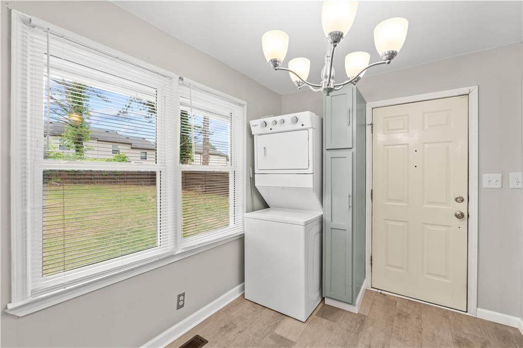 2161 Rochelle Way Southwest Atlanta, GA 30349 - Photo 5 of 15 a room with a washer and dryer