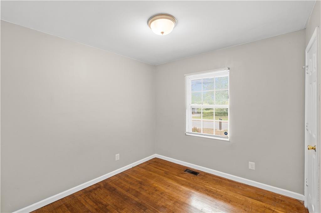2161 Rochelle Way Southwest Atlanta, GA 30349 - Photo 8 of 15 an empty room with a window
