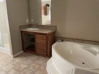 323 County Road 305 Panhandle, TX 79068 - Photo 20 of 23 a bathroom with a sink and vanity