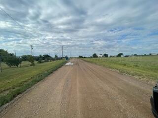 323 County Road 305 Panhandle, TX 79068 - Photo 23 of 23 a view of a street with an ocean and trees