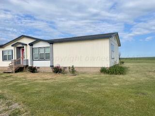 323 County Road 305 Panhandle, TX 79068 - Photo 4 of 23 a view of a house with a outdoor space