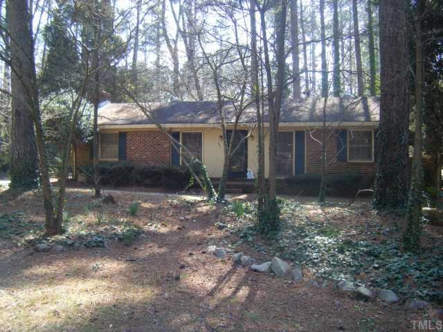 861 Cranbrook Road Raleigh, NC 27609 - Photo 1 of 3 a view of a house with a yard