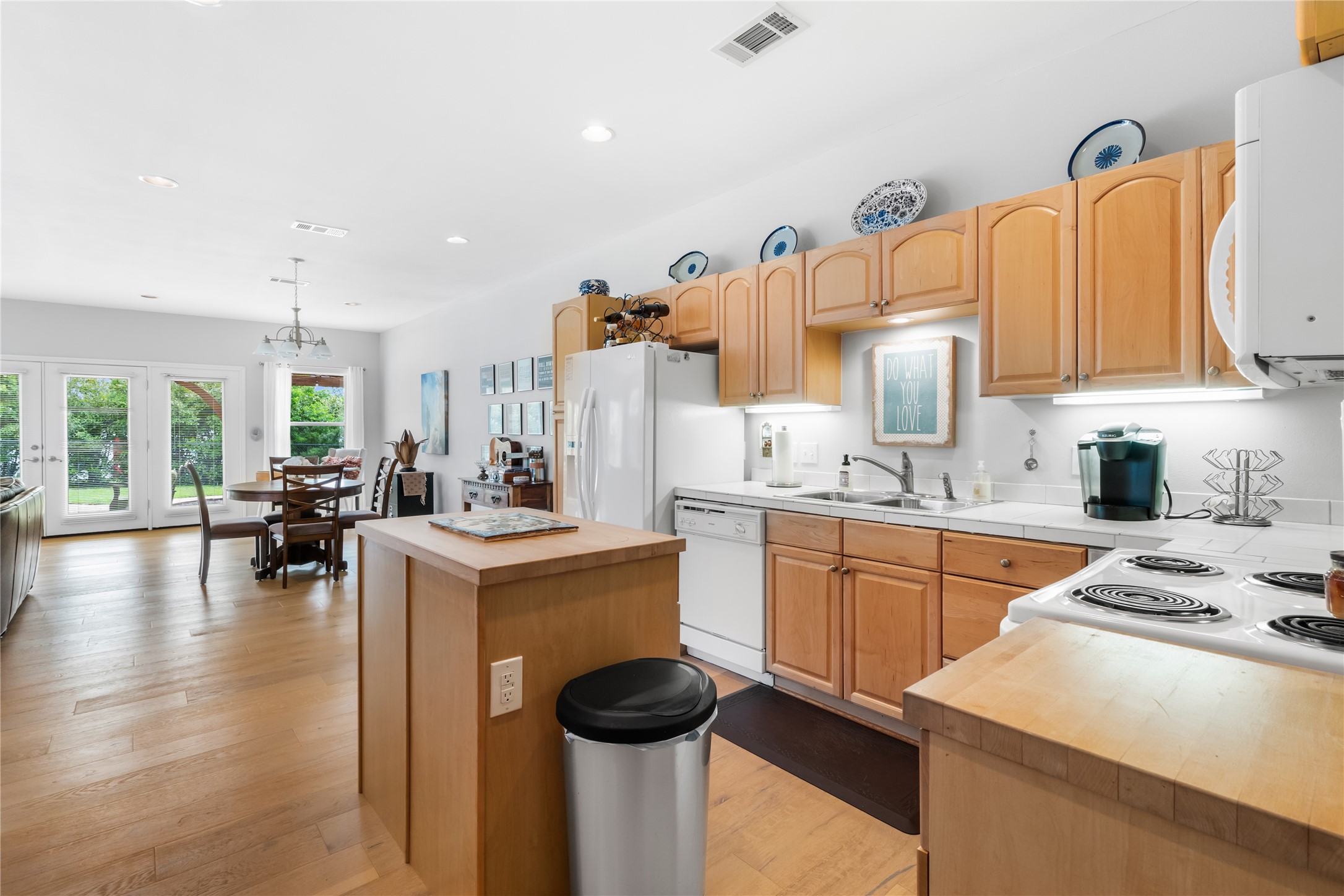 5500 Sunset Ridge, Unit A & B Austin, TX 78735 - Photo 16 of 32 a kitchen with a sink stove and cabinets