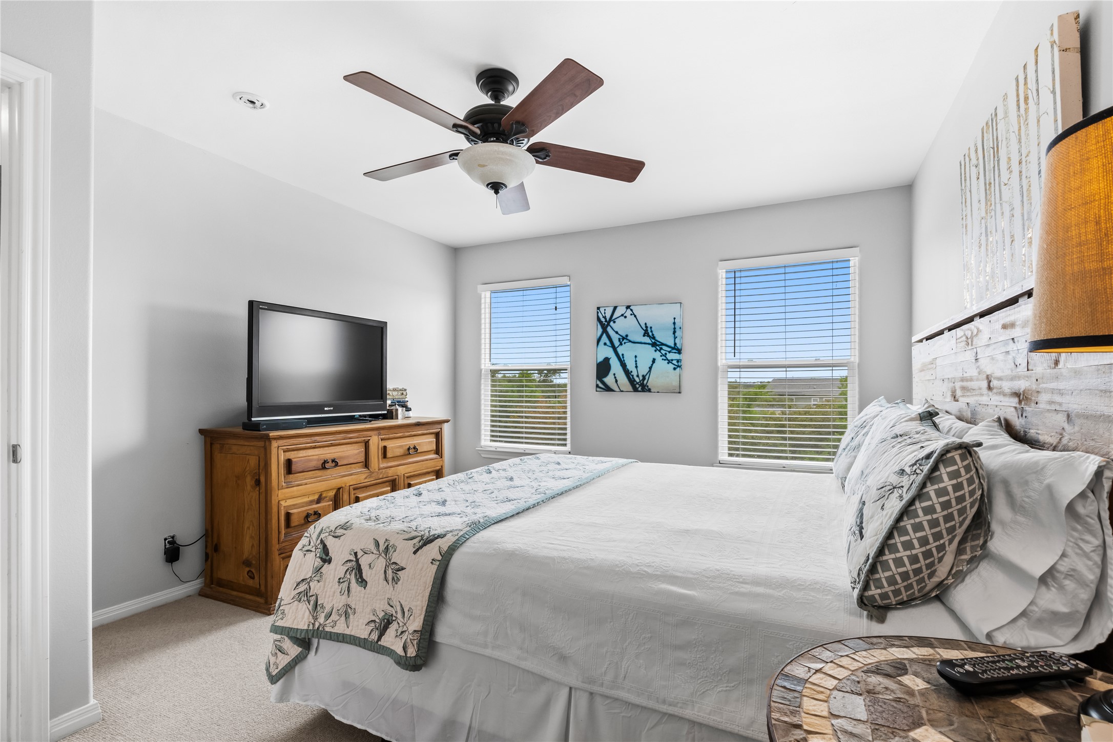 5500 Sunset Ridge, Unit A & B Austin, TX 78735 - Photo 20 of 32 a bedroom with a large bed and a flat tv screen