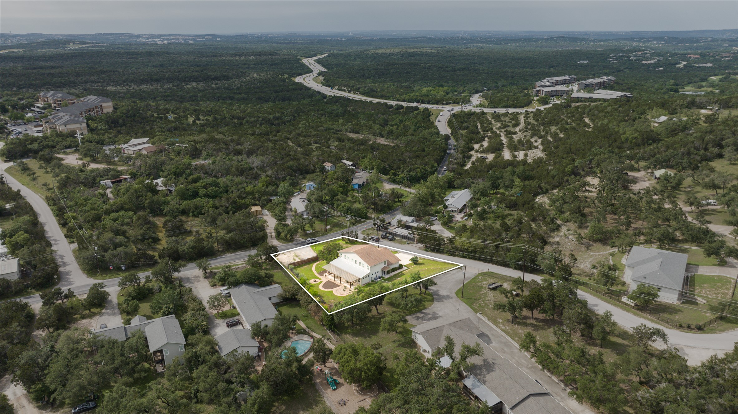 5500 Sunset Ridge, Unit A & B Austin, TX 78735 - Photo 2 of 32 an aerial view of a house with a yard