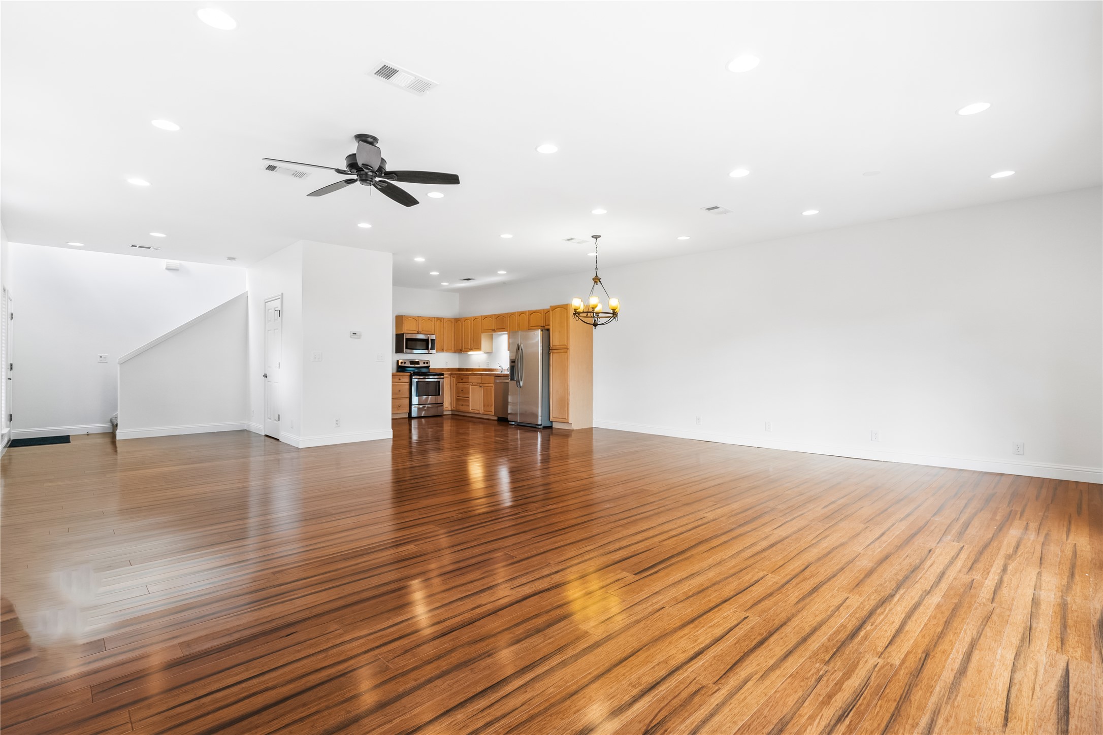 5500 Sunset Ridge, Unit A & B Austin, TX 78735 - Photo 22 of 32 a view of empty room with wooden floor and ceiling fan