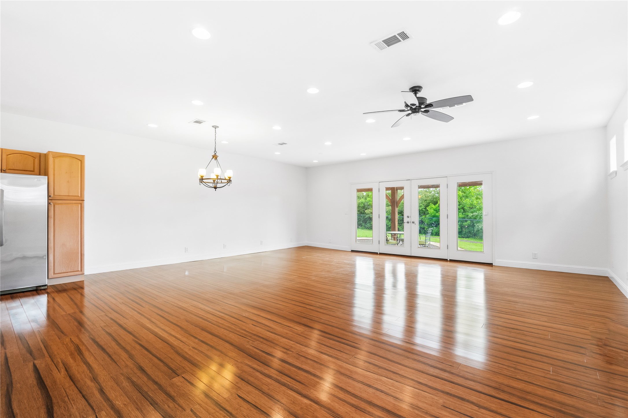 5500 Sunset Ridge, Unit A & B Austin, TX 78735 - Photo 24 of 32 a view of an empty room with wooden floor and a window