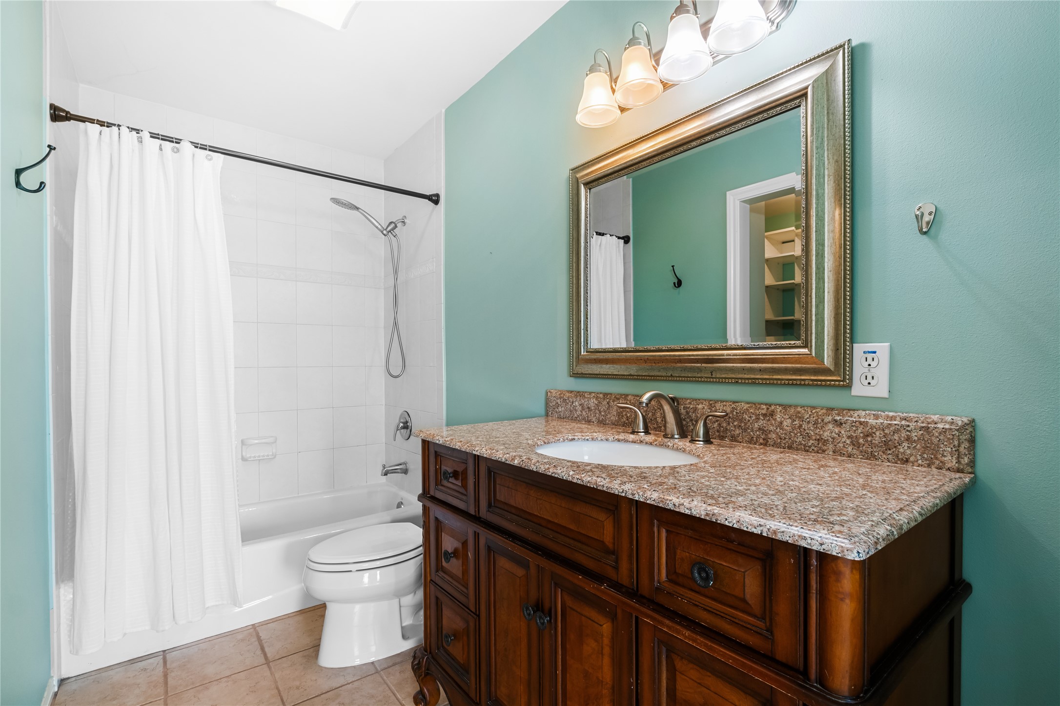 5500 Sunset Ridge, Unit A & B Austin, TX 78735 - Photo 29 of 32 a bathroom with a granite countertop sink and a mirror