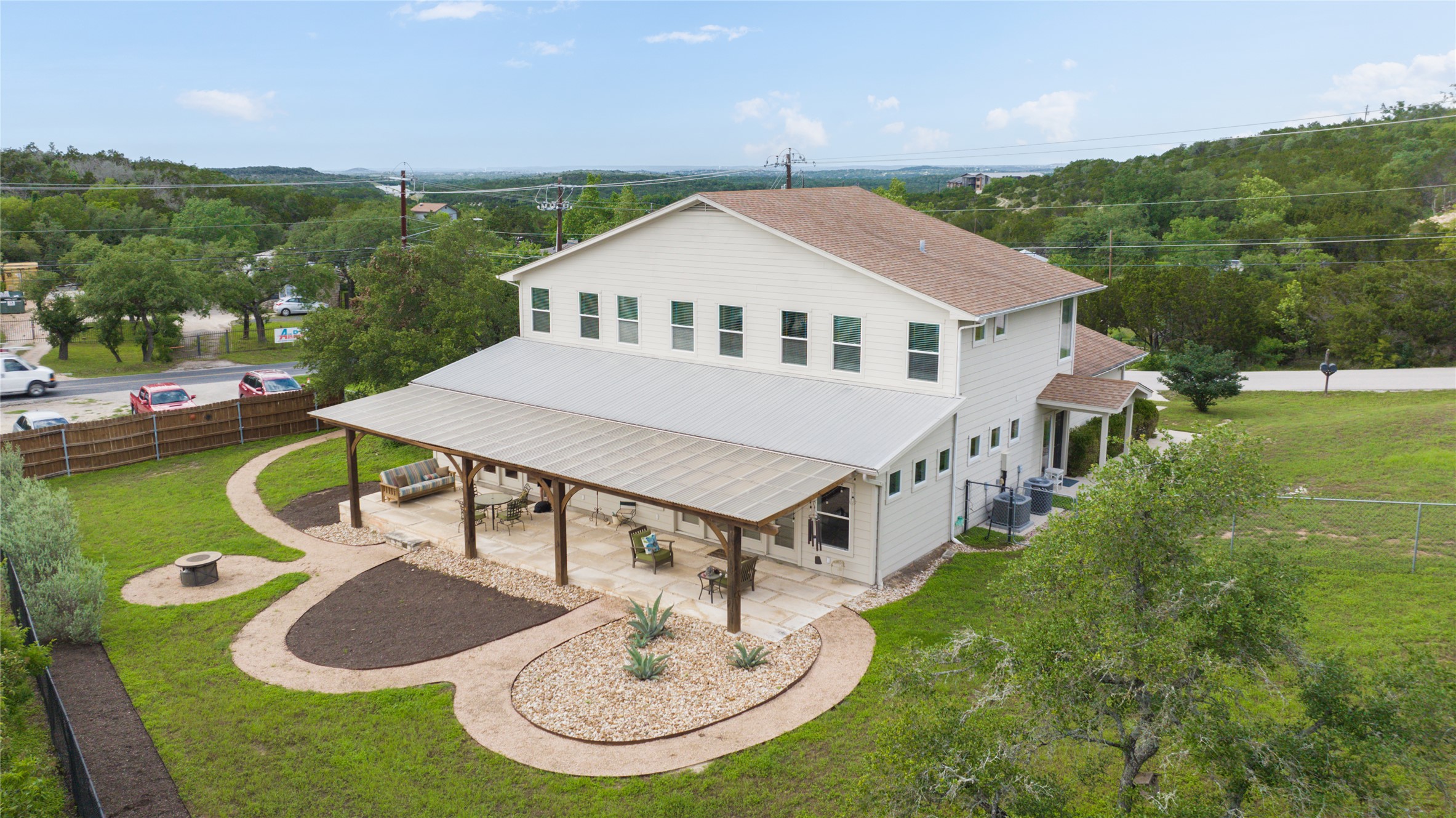 5500 Sunset Ridge, Unit A & B Austin, TX 78735 - Photo 4 of 32 a aerial view of a house with swimming pool and trees in the background