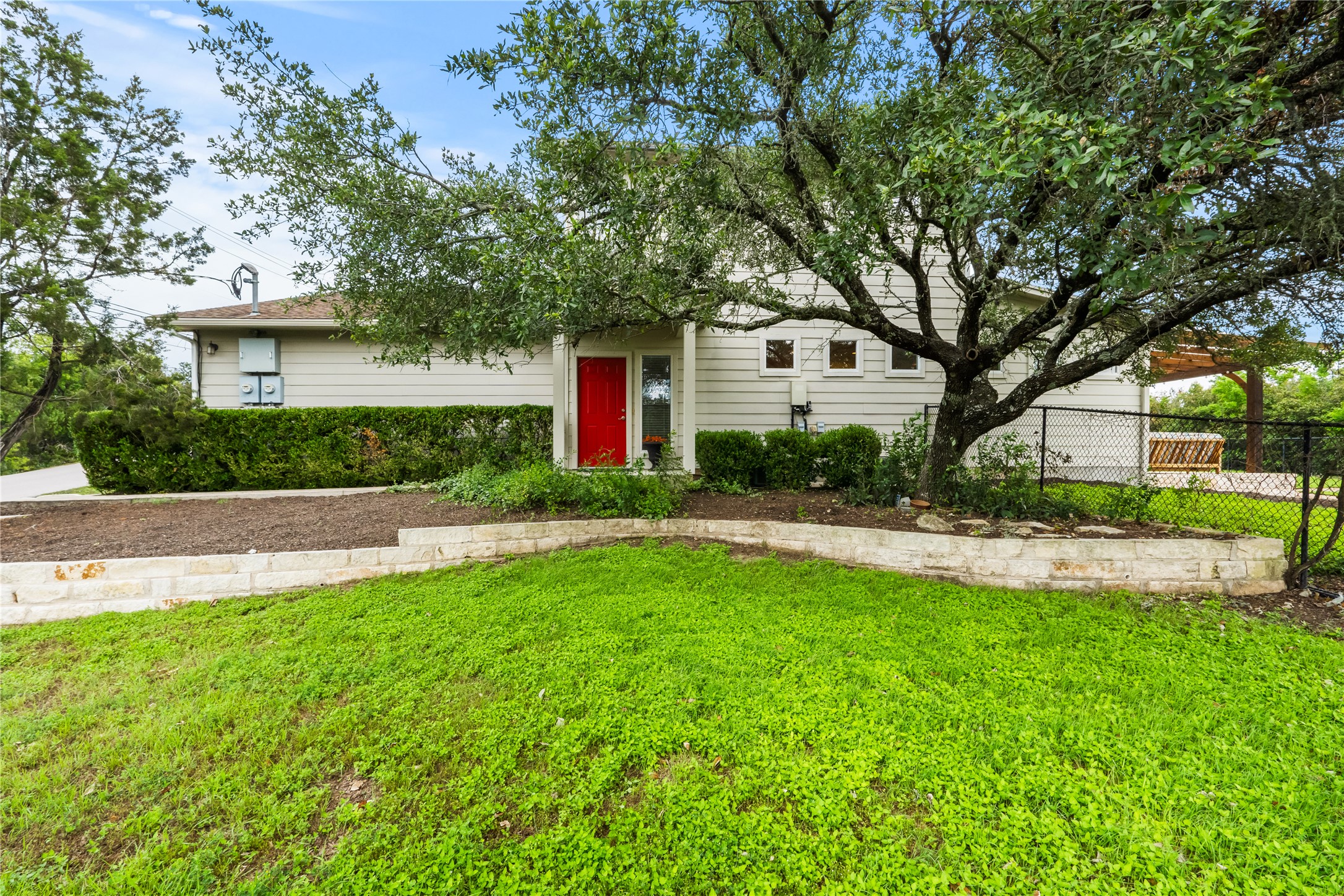 5500 Sunset Ridge, Unit A & B Austin, TX 78735 - Photo 6 of 32 a front view of a house with a yard and trees