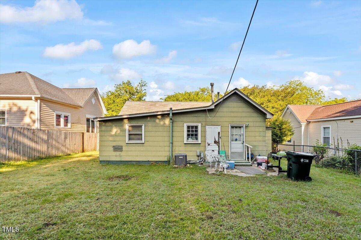 204 Heck Street Raleigh, NC 27601 - Photo 6 of 13 a backyard of a house with table and chairs
