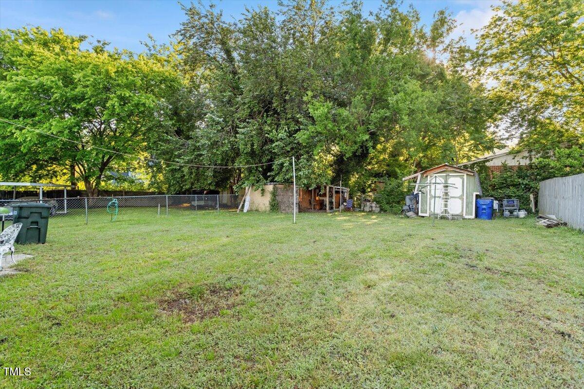 204 Heck Street Raleigh, NC 27601 - Photo 7 of 13 a backyard of a house with lots of green space