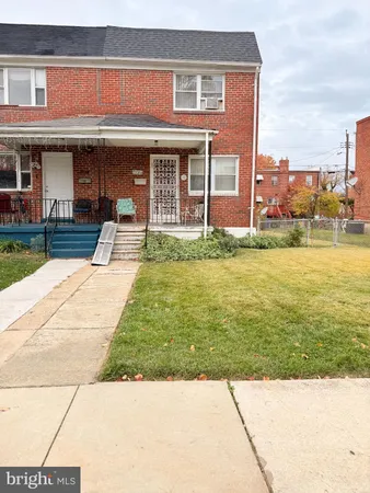 a view of a house with a swimming pool and a yard