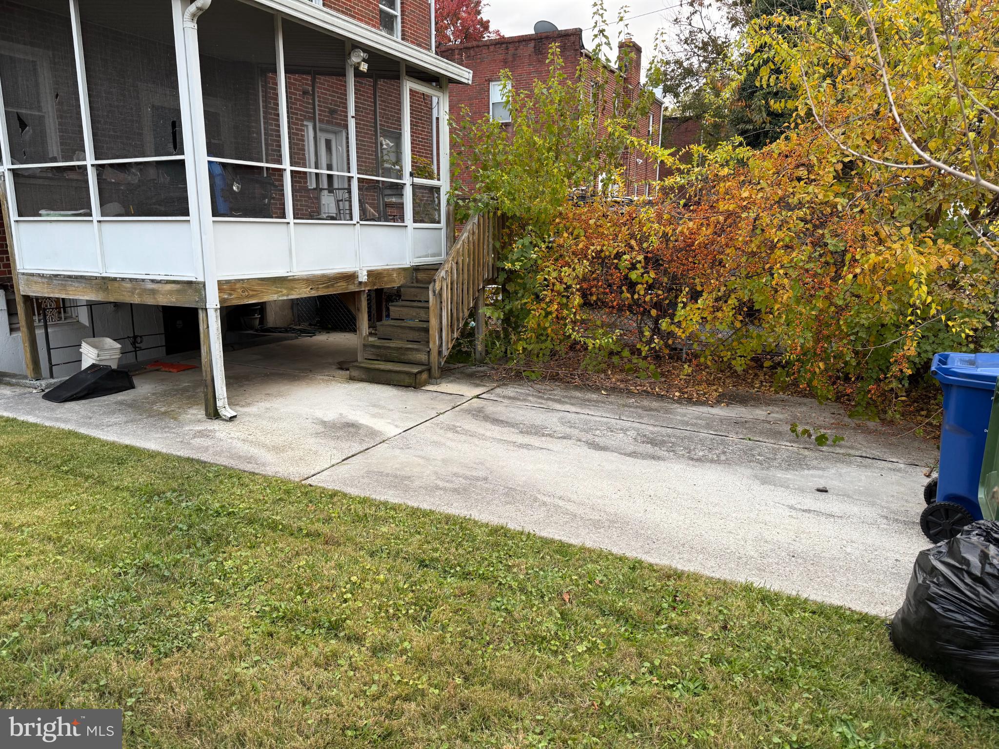 3720 Bartwood Road Baltimore, MD 21215 - Photo 3 of 8 a large room with a large window and yard