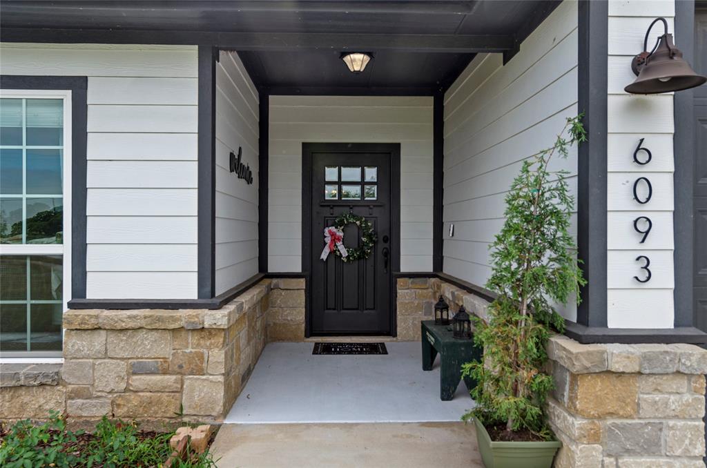 6093 Farm To Market Road 730 North Decatur, TX 76234 - Photo 3 of 28 a front view of a house with a potted plant