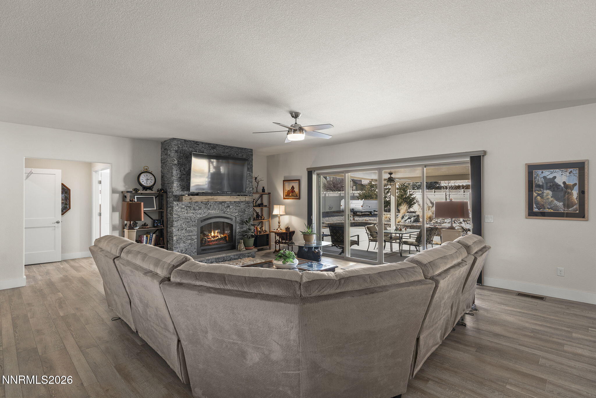 404 Chianti Way Dayton, NV 89403 - Photo 14 of 42 a living room with fireplace furniture and a wooden floor