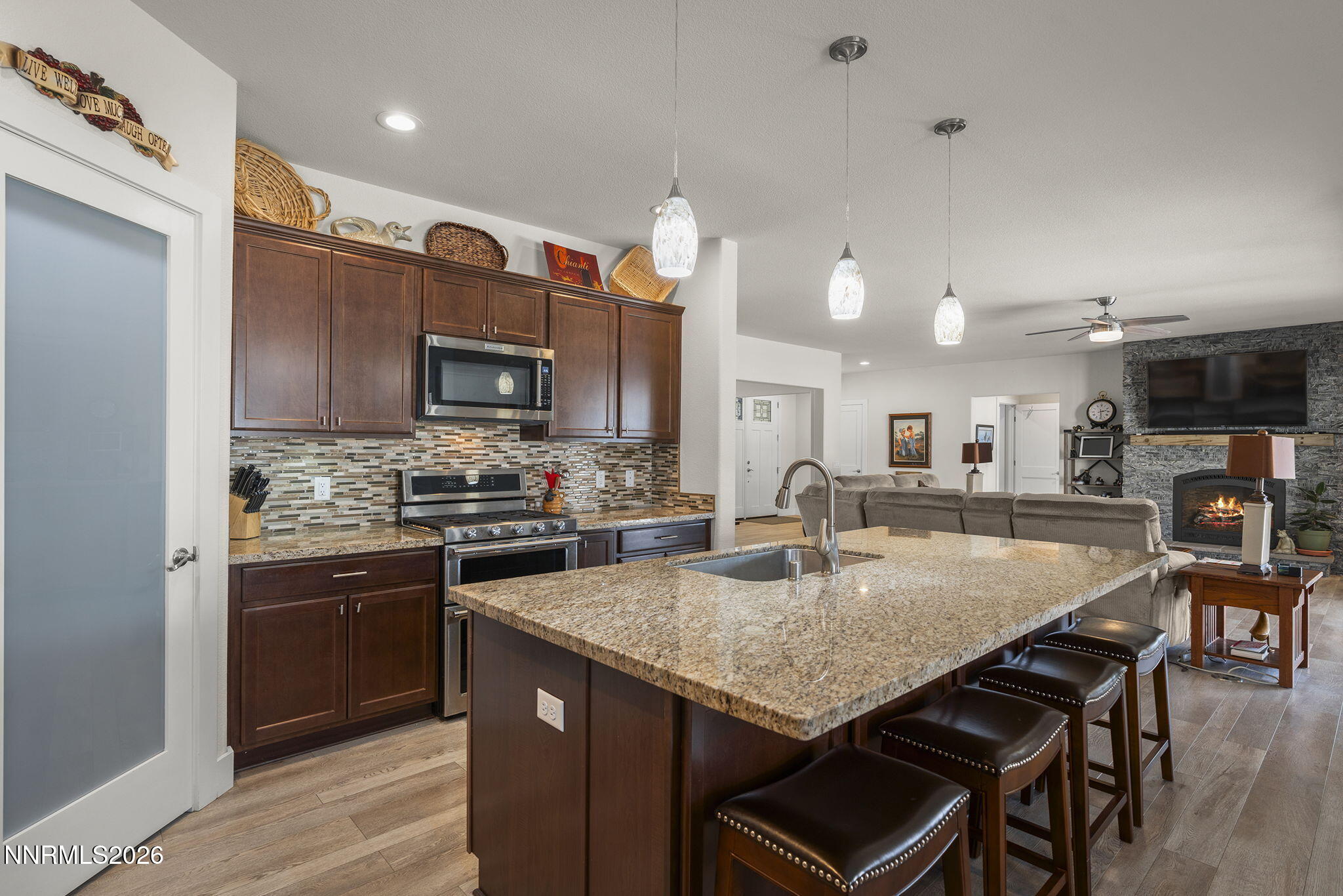 404 Chianti Way Dayton, NV 89403 - Photo 17 of 42 a kitchen with granite countertop kitchen island a sink counter top space stainless steel appliances and cabinets